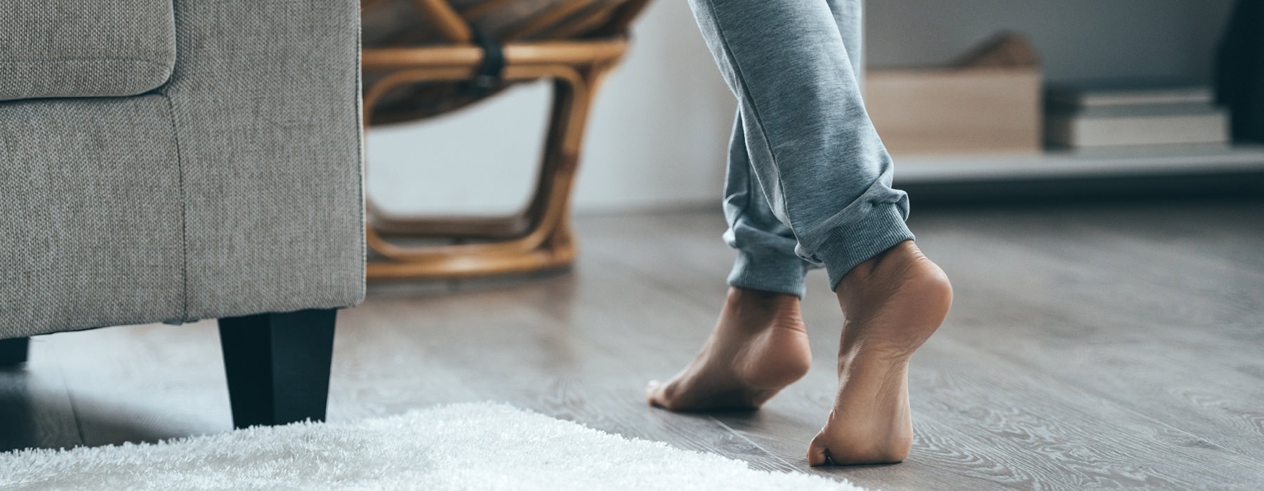 Woman walking in living room barefooted